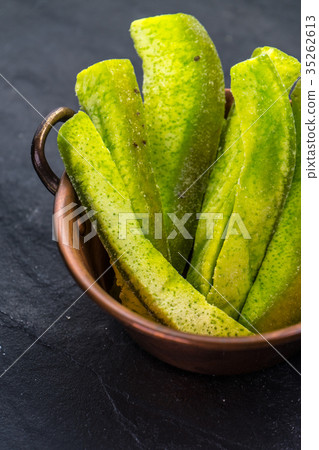 Candied fruits from pomelo in a copper bowl on a 35262613