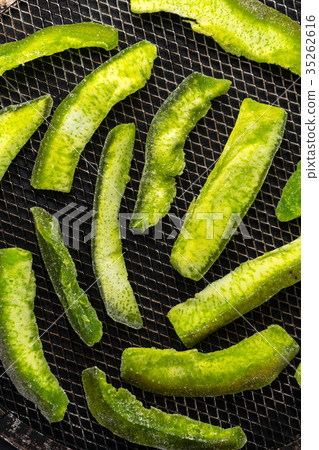 Candied fruits from a bright green pomelo on a 35262616