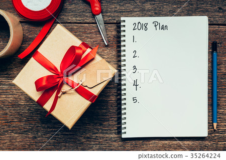 2018 Plan text on notebook paper with gift box. 35264224