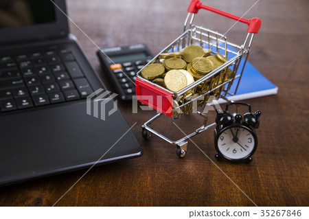 Shopping trolley with coins 35267846