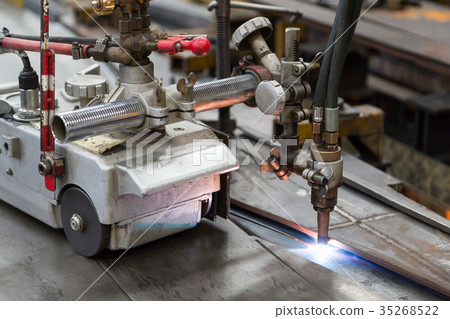 Gas cutting machine is cutting the sheet metal. Gas cutting machine is cutting the sheet metal. 35268522