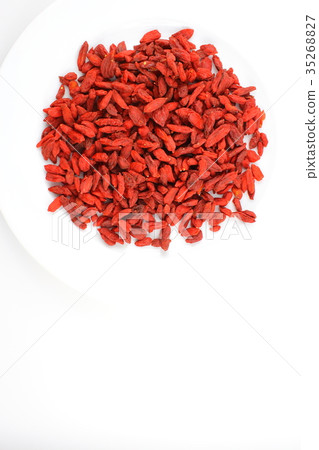 dried goji berries on a white plate 35268827