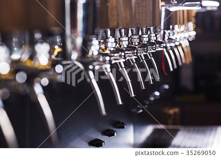 Beer taps in a pub Beer taps in a pub 35269050