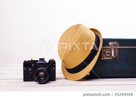 straw hat old suitcase and camera 35269389