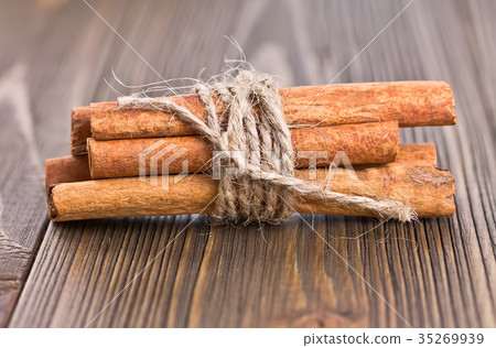 some cinnamon sticks tied with twine some cinnamon sticks tied with twine 35269939