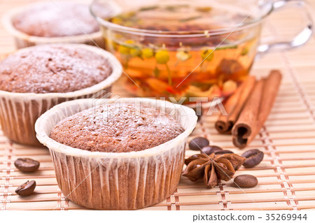 Chocolate muffins with a herbal tea Chocolate muffins with a herbal tea 35269944