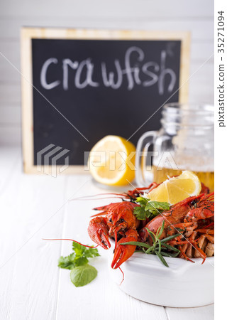 Boiled crayfish in the plate with beer Boiled crayfish in the plate with beer 35271094