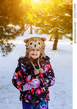 Funny little girl having fun in beautiful winter Funny little girl having fun in beautiful winter 35271495