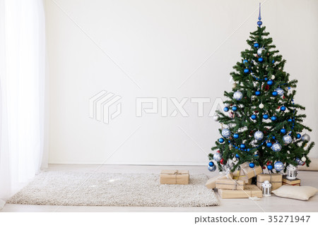 Christmas tree with blue in a white room with toys Christmas tree with blue in a white room with toys 35271947