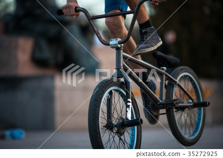 Young bicyclist boy riding on bmx bicycle Young bicyclist boy riding on bmx bicycle 35272925