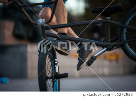 Young bicyclist boy riding on bmx bicycle  35272926