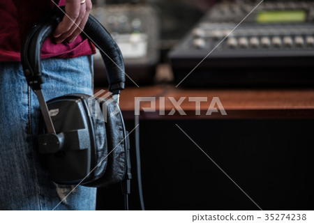 silhouette of a man holding headphones in radio silhouette of a man holding headphones in radio 35274238