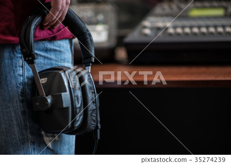 silhouette of a man holding headphones in radio silhouette of a man holding headphones in radio 35274239