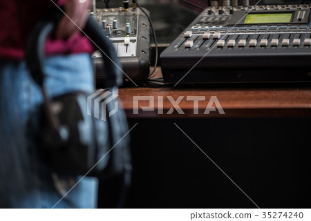 silhouette of a man holding headphones in radio silhouette of a man holding headphones in radio 35274240