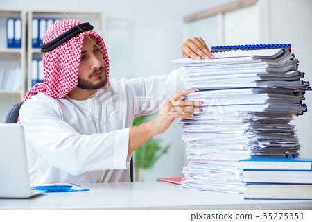Arab businessman working in the office doing Arab businessman working in the office doing 35275351