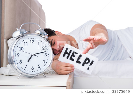Man in bed suffering from insomnia Man in bed suffering from insomnia 35275649