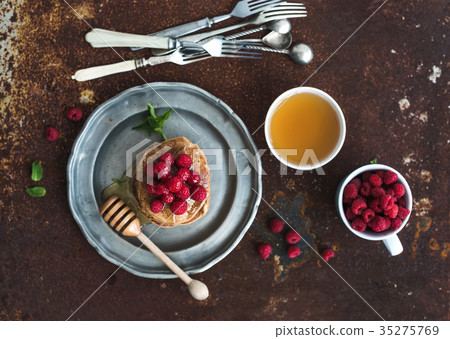 Breakfast set. Buckwheat pancakes with fresh Breakfast set. Buckwheat pancakes with fresh 35275769