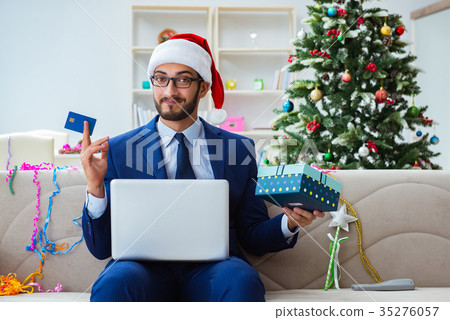 Businessman working at home during christmas 35276057
