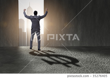 Businessman casting dollar shape shadow in 35276405