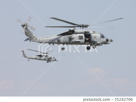 US Navy MH-60R Seahawk and MH-60S Nighthawk carrier helicopter flying in the sky 35282706