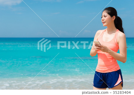 happy beautiful lady holding mobile cell phone happy beautiful lady holding mobile cell phone 35283404