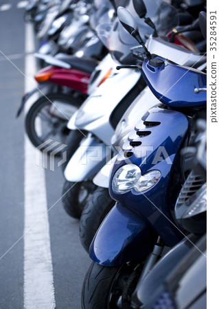 Scooters parked in the city Scooters parked in the city 35284591