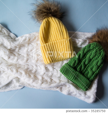 woolen light blue scarf, gloves and hat over white 35285750