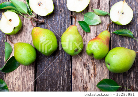 Pear on wooden rustic background. Top view. Pear on wooden rustic background. Top view. 35285981