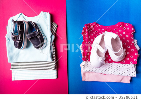 Folded blue and pink bodysuit with boat shoes Folded blue and pink bodysuit with boat shoes 35286511
