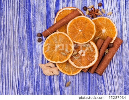 Dry slices of orange, cinnamon and cardamom Dry slices of orange, cinnamon and cardamom 35287984