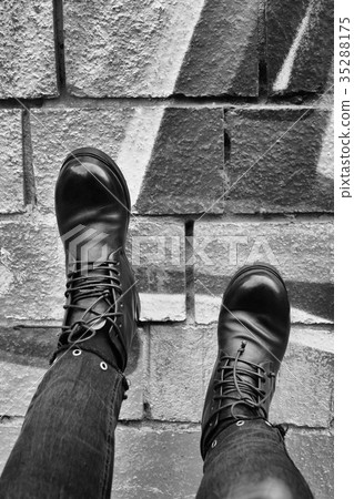 Leather black shoes on legs Leather black shoes on legs 35288175