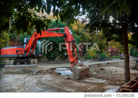 Excavator being parked at a highway construction 35288180