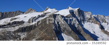 Mountain range in Switzerland covered by Glacier. 35289592