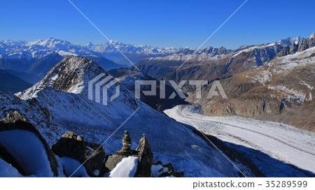 Tongue of the Aletsch glacier and high mountains. 35289599