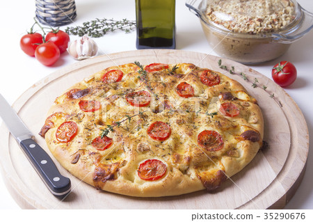 Fresh bread focaccio with tomatoes and cheese Fresh bread focaccio with tomatoes and cheese 35290676