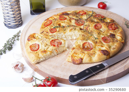 Fresh bread focaccio with tomatoes and cheese Fresh bread focaccio with tomatoes and cheese 35290680