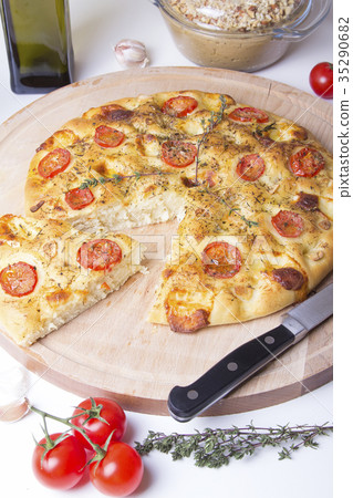Fresh bread focaccio with tomatoes and cheese Fresh bread focaccio with tomatoes and cheese 35290682