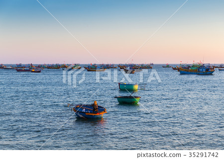 Vietnam village fishing boats ships sunset light Vietnam village fishing boats ships sunset light 35291742
