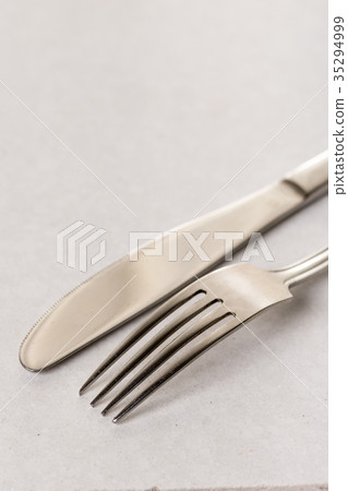 Silverware metal fork and knife on the marble Silverware metal fork and knife on the marble 35294999