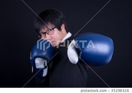 young business man wearing suit with boxing gloves 35296328