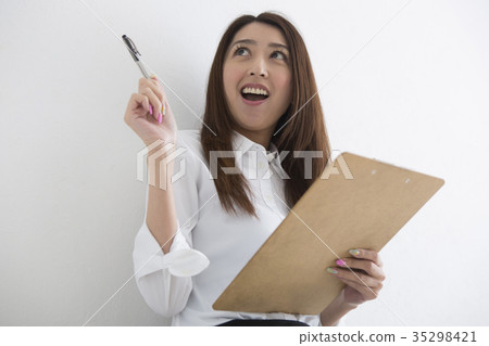 A woman taking a note A woman taking a note 35298421