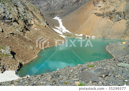 Blue lake in Aktru valley. Altai Republic, Russia Blue lake in Aktru valley. Altai Republic, Russia 35299377