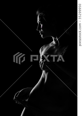 Black and white silhouette of young, sporty and Black and white silhouette of young, sporty and 35299950