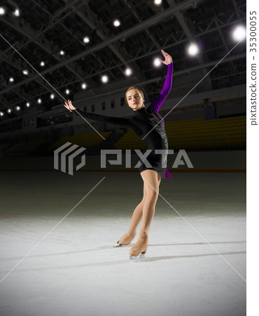 Woman figure skater at sports hall Woman figure skater at sports hall 35300055