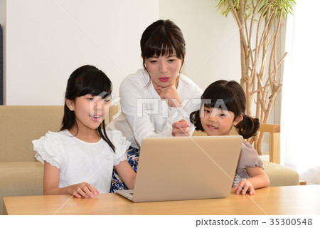 Parent and child with computer mother and child 35300548