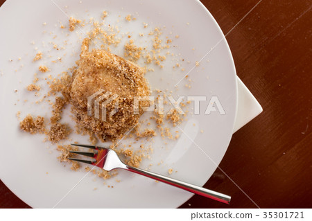 Flat lay above plum dumplings on the white plate Flat lay above plum dumplings on the white plate 35301721
