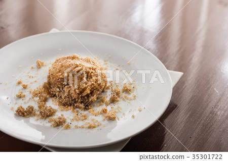 Plum dumplings on the white round plate Plum dumplings on the white round plate 35301722