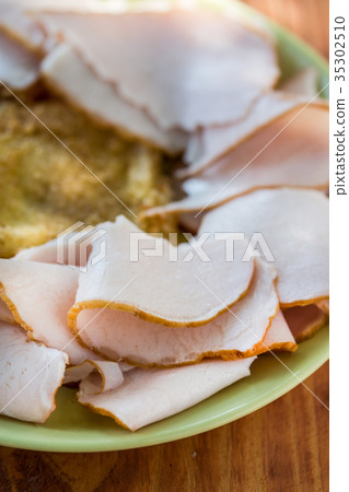 Domestic ham served on the plate with cheese 35302510