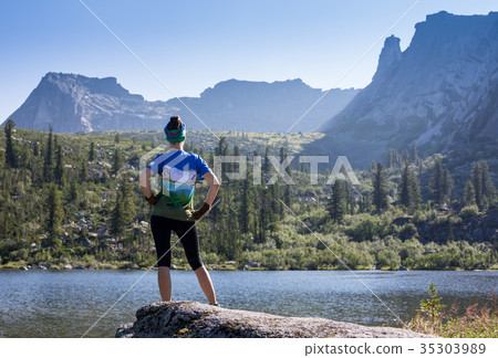 Girl enjoy a beautiful mountain lake, in the Girl enjoy a beautiful mountain lake, in the 35303989