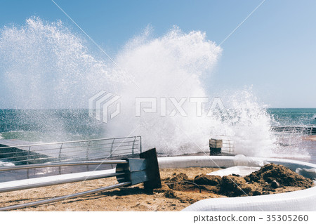 Big waves breaking on the embankment Big waves breaking on the embankment 35305260